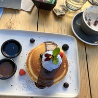 OG gluten free, vegan pancakes with spirulina, salted caramel whipped cream (interesting texture and flavor!)and house made “Nutella” like chocolate sauce with maple syrup. Yum at Hustle n' Flow Eatery in San Pedro De Alcantara