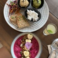 Smoothie bowl, toast with houmous and vegan feta, health shot, everything was amazing 😍 at Hustle n' Flow Eatery in San Pedro De Alcantara