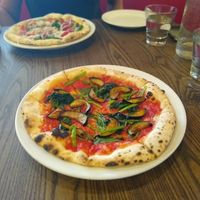 Pizza with aubergine and spinach at Cafe La Boheme - Odaiba in Tokyo