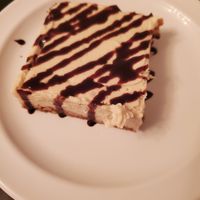 Vegan cheesecake with chocolate drizzle at Vegelicious in Nashville