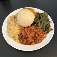 Soul food. BBQ chicken, collard greens, sweet potatoes, Mac and cheese and a roll.  at Vegelicious in Nashville