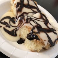 Warm white cake w/vanilla frosting and chocolate sauce.  at Vegelicious in Nashville