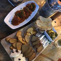 top: vegan albóndigas (meatballs) below: cheese platter deluxe  at Amarre 69 in Barcelona