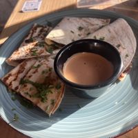 Minced Meat Quesodillas with cheese sauce on sidee  at Amarre 69 in Barcelona