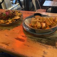 Nachos con carne and patatas bravas 69  at Amarre 69 in Barcelona