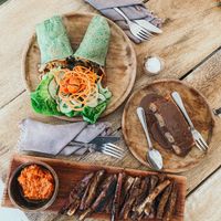 Eggplant fries, banana bread, & spirulina crepes! The eggplant fries and banana bread are both delicious and vegan. My fiance had the crepes which are vegetarian he enjoyed them! at Musa Cookery in 