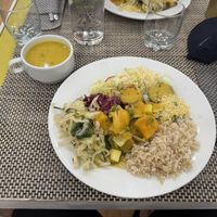 Veg & millet soup; rice, cabbage, seitan stew and more on the plate  at Vida Leve in Faro