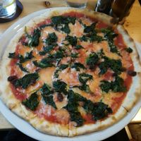 Vegan pizza with spinach at Manso Pizzeria in Barcelona
