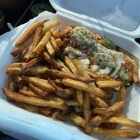 My sisters veggie dog and dirty fries! at Sammy Barker's in Pensacola