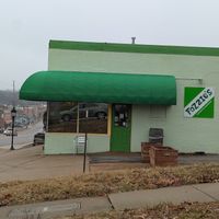 There are picnic tables behind the building for eating in nice weather. at Fozzie's Sandwich Emporium in Richmond Heights