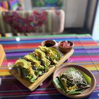 Tempeh & Teriyaki Tacos and Kraut cracker w/ guacamole, mushrooms, pesto & sesame seeds.  at Wachuma in Antigua