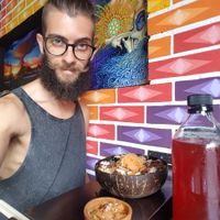 Eating my bowl and drinking some blueberry kombucha at Wachuma in Antigua