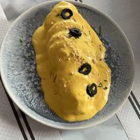 Papas a la huancaína  at Los Andenes Vegan in Madrid