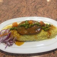 Tacu tacu de pallares con filete de seitan at Los Andenes Vegan in Madrid