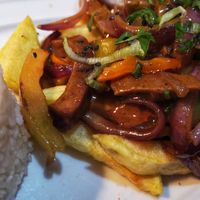 Seitan with chips and Peruvian typical sauce  at Los Andenes Vegan in Madrid