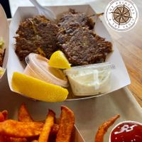 BAY CAKES (in a boat or on a bun)
Old Bay artichoke patties, on romaine lettuce, with tartar & radish sauces.  at Beaut Burger in Tucson