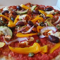 Avocado Onion Olive Caper Pepper Pizza with Vegan Cheese at Stripped Pizza - Talacker in Zurich