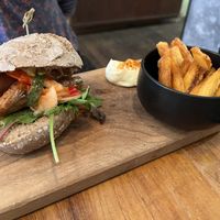 Choripán Burger w/ Fries  at SOIL Vegan Cafe - West in Amsterdam