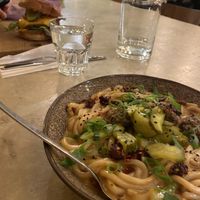 Cheddar Burger in the background  at SOIL Vegan Cafe - West in Amsterdam