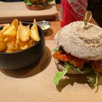Reuben Burger with Tempeh, Kimchi and fries at SOIL Vegan Cafe - West in Amsterdam