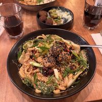 „Ben Ben Noodles“ creamy sesame sauce with udon noodles, meatballs, pak soy, crispy chili oil, scallions and pickles - spicy!!  at SOIL Vegan Cafe - West in Amsterdam