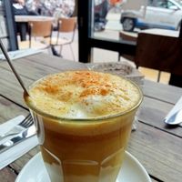 Turmeric golden latte with almond milk at SOIL Vegan Cafe - West in Amsterdam