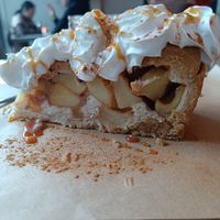 Apple pie. Comes standard with whipped cream and caramel sauce at SOIL Vegan Cafe - West in Amsterdam