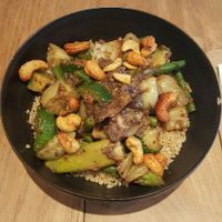 Bowl with quinoa, asparagus, green curry etc. at SOIL Vegan Cafe - West in Amsterdam