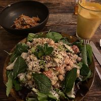 Middle Eastern salad with vegan chicken. Yum! Turmeric latte and side of kimchi 👍🏻👍🏻 at SOIL Vegan Cafe - West in Amsterdam