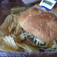 $9.50 for this impossible burger (I put vegan cheese vegan mayo tomato lettuce & onion on it) it was amazinggggg! Comes with chips & pickle  at Aleko's 2 Go in Hagerstown