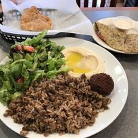 Rice and Lentil platter (hummus, salad, pita) and zatar pie on the side with tahini sauce. All fantastic! at Layla's Falafel in Fairfield
