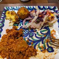 Half of the chili sin carne, coleslaw, and corn fritters at El Piano in Granada