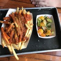 Curry fries and salad at DMen Tap in Chicago