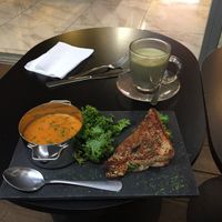 I already ate half my grilled cheese before I took this. It was so good, and the tomato basil soup and matcha latte were too! at Gia Vegan Pastries in San Pedro