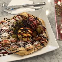 Waffle with mango and berry ice cream. Chocolate sprinkles and kiwi on top. at Leckerschmecker in Cologne