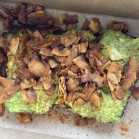 Avocado toast with coconut bacon and tajín  at The Green Spork in Richmond Hill