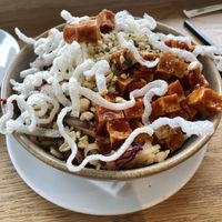 Noodle Bowl - spicy tofu, rice noodles, cabbage, carrot and beet, cashews, cilantro, mint, basil, sesame, soy and ginger at Heirloom Vegetarian in West Vancouver