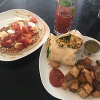 Vegan burrito with a side of golden pancakes (v) + beetroot/carrot/OJ juice  at Lazy Hippo at The Whiskey House in San Diego