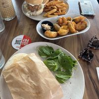 Panini, side of potatoes, vegan chicken burger  at Yavanna in Paddington
