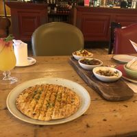 Tapas board with flatbread and dips/dishes  at Lounges - Paramo Lounge in Solihull