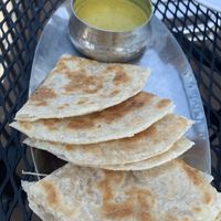 Roti paratha and curry dip. Roti came out hot and fresh, and the curry dip was perfect, with little chunks of potato in it. A must try.  at Sambal Thai & Malay in Irvington