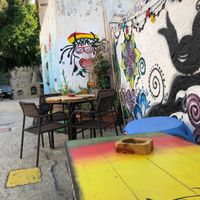 Spot the happy cow sticker next to the happy cow painting! at Mad Irie in Crete