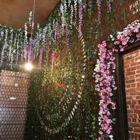 Beautiful decor, there's flowers EVERYWHERE  at Hell Below in Carlisle