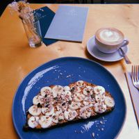 Cappuccino c/ soy milk + peanut butter banana toast at Noshi Coffee in Porto