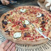 Pizza with vegan cheese and peanuts at La Pizzeria in Maribor
