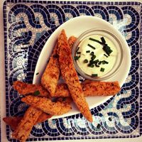 Breadcrumbed homemade seitan with creamy cashew ranch dressing. at Meson Mudejar in Archez