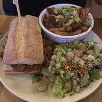 Lola Cheese steak with a side of poutine and Caesar salad   at Lola Rosa - Places des Festivals in Montreal