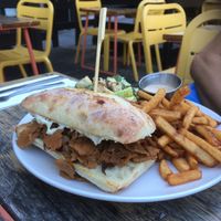Cheesesteak with white sauce, fries and Caesar  at Lola Rosa - Places des Festivals in Montreal