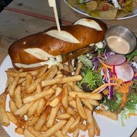 I got the steak and cheese sandwich and my husband got the nachos! It was all delicious and portion sizes were pretty big!! Love the comfort style food this place brings.   at Lola Rosa - Places des Festivals in Montreal