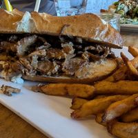 Cheese steak on a pretzel bun at Lola Rosa - Places des Festivals in Montreal